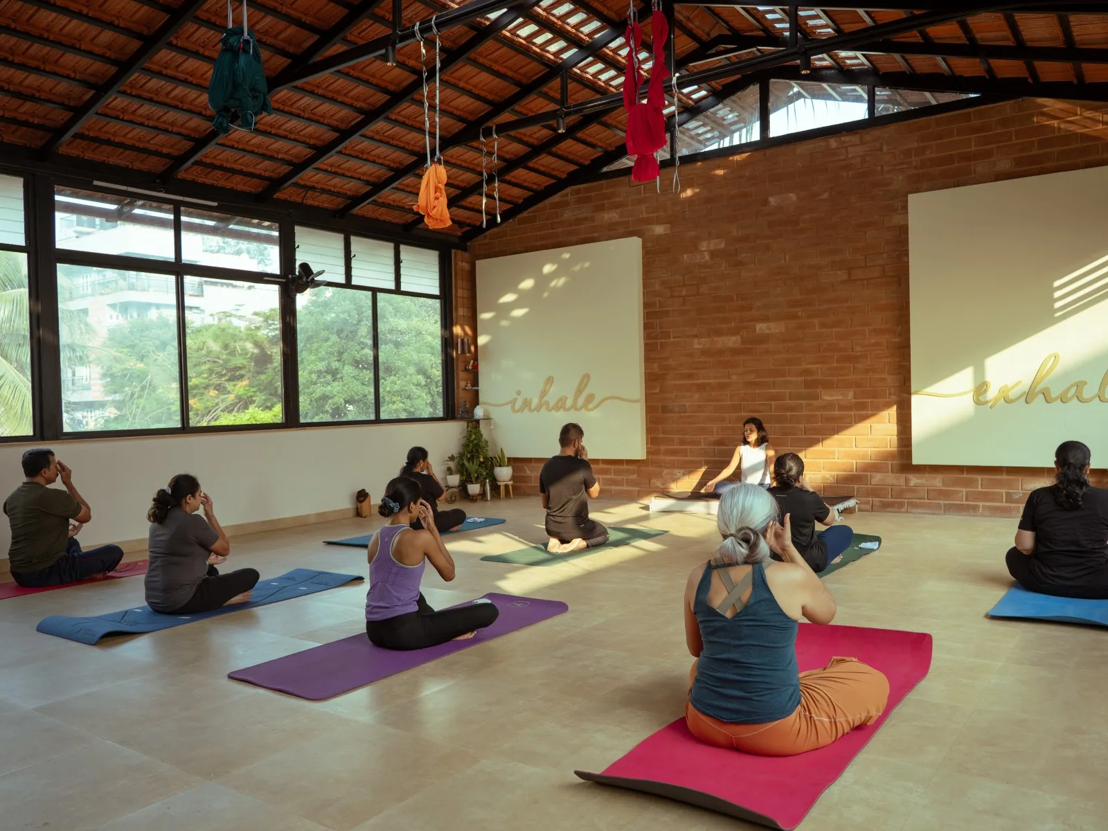 Group yoga class in session at Absolute Yoga HRBR Layout Kalyan Nagar Bangalore