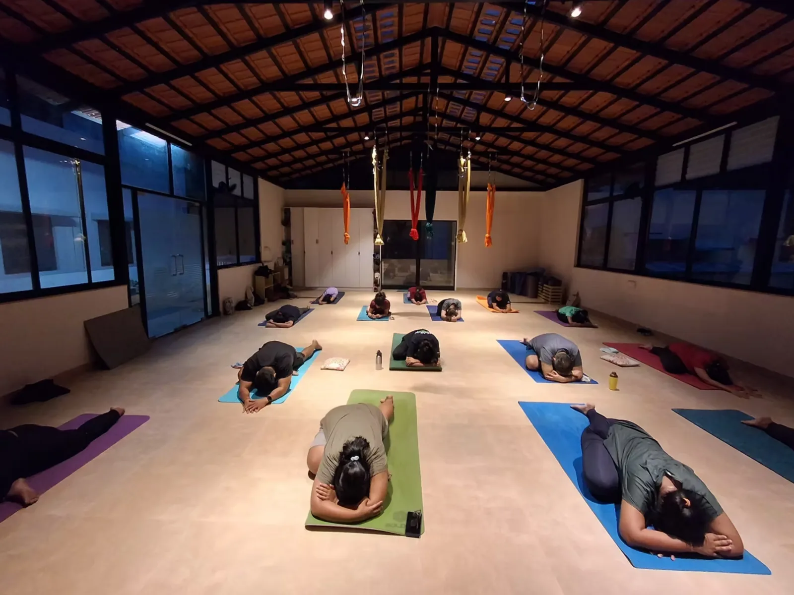 Beginner yoga class in Kalyan Nagar Bangalore with students practicing discipline and focus at Absolute Yoga studio