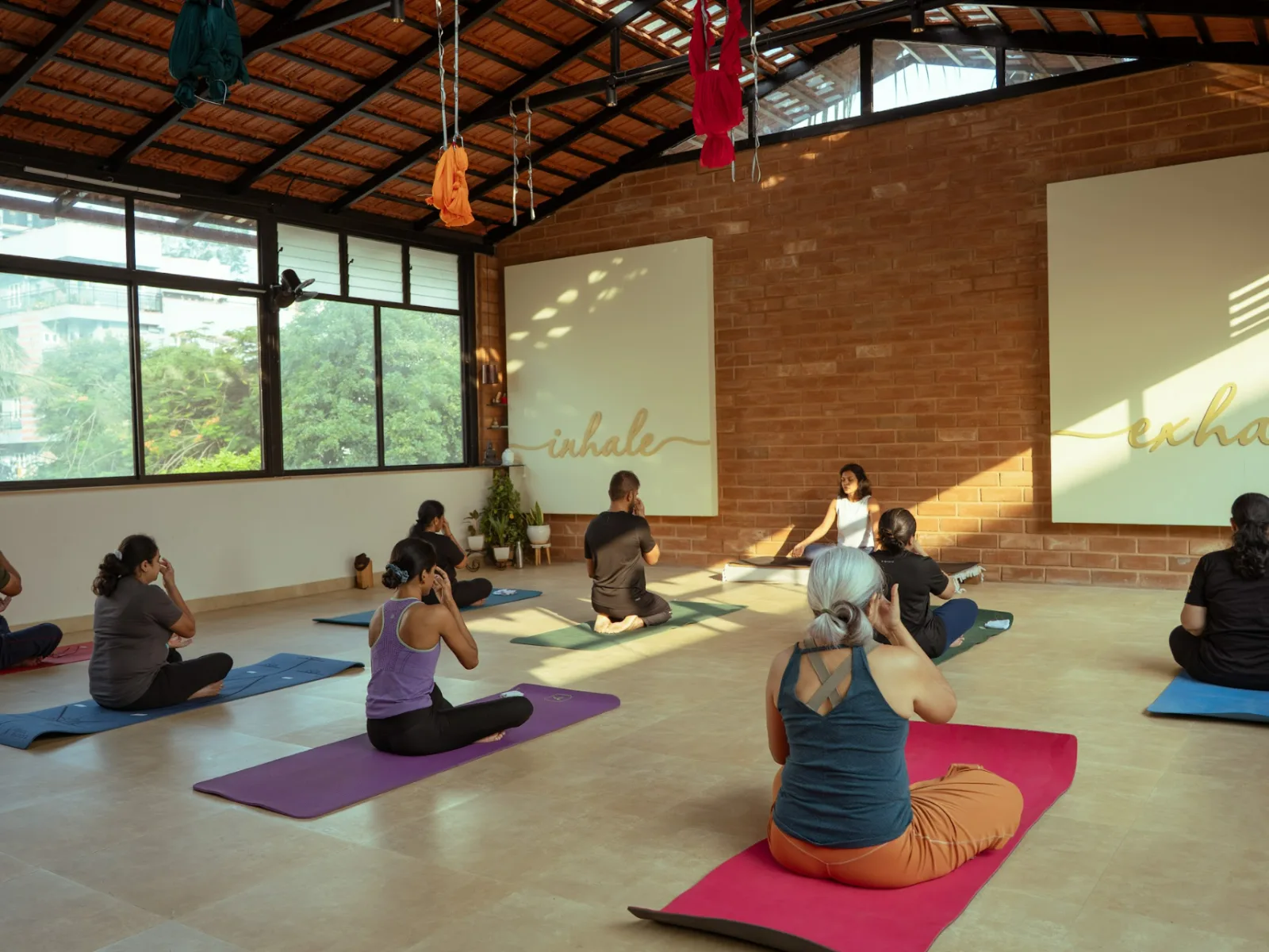 Yoga for lower back pain relief in Bangalore with stretching poses at Absolute Yoga Kalyan Nagar