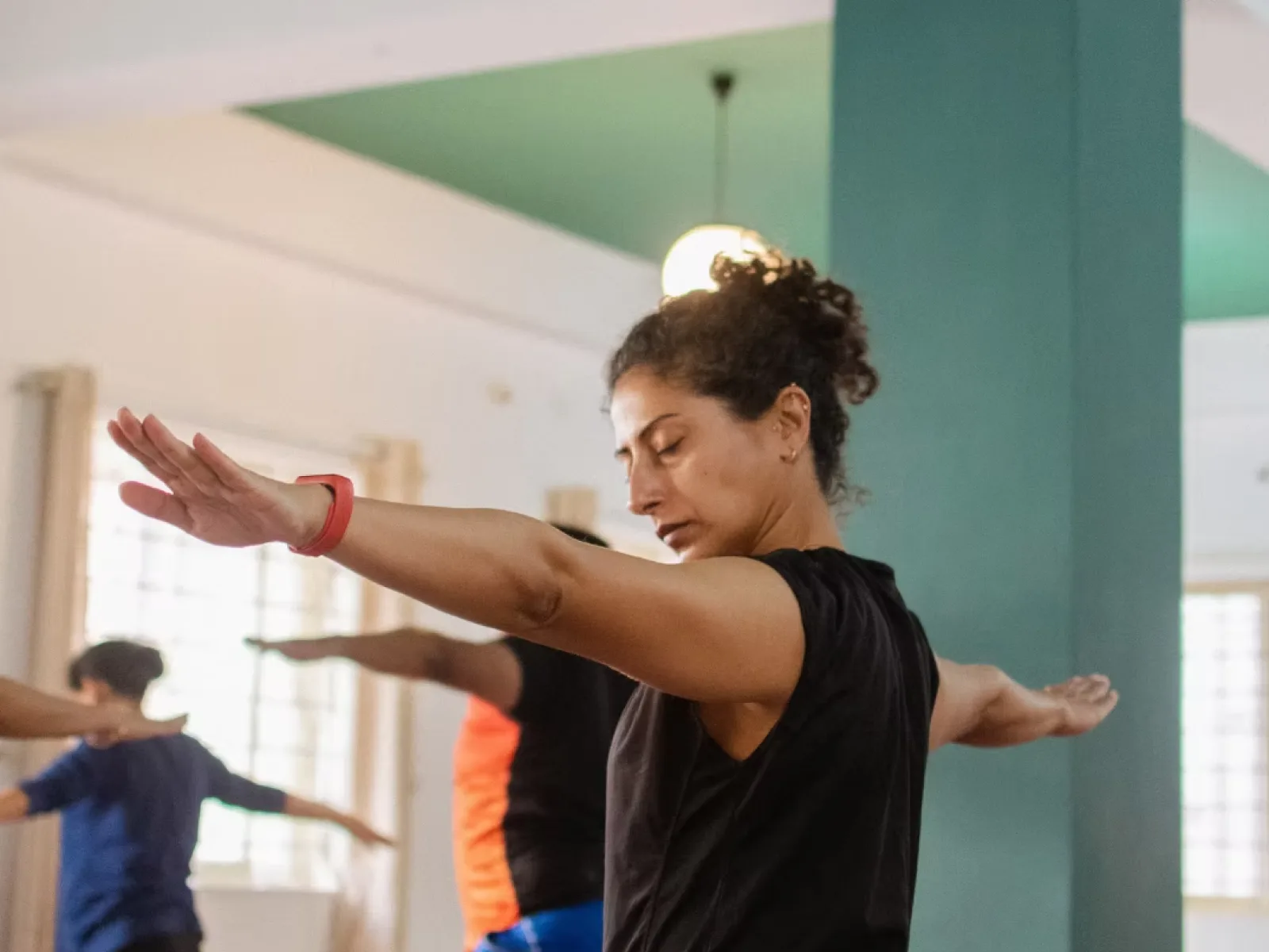 Daily yoga practice in Bangalore showing abhyasa for strength flexibility at Absolute Yoga Kalyan Nagar