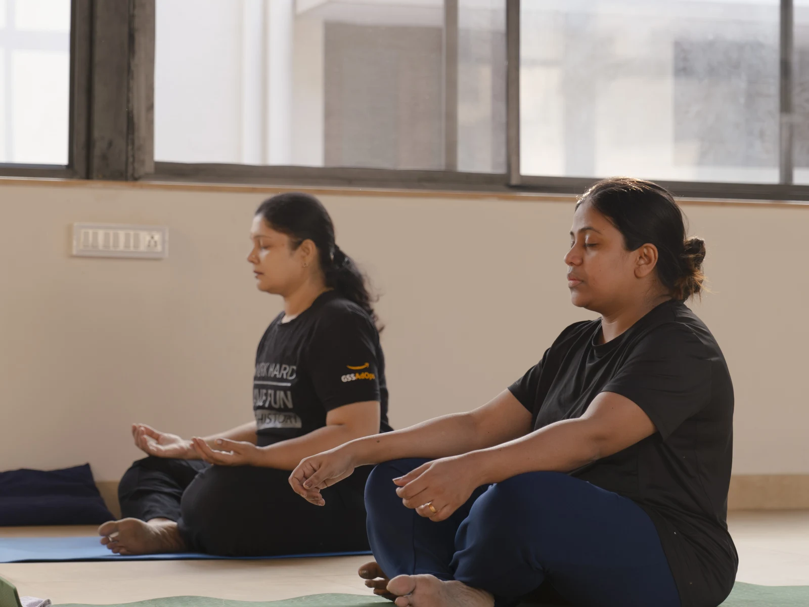 Beginner yoga class in Kalyan Nagar Bangalore with students practicing discipline and focus at Absolute Yoga studio