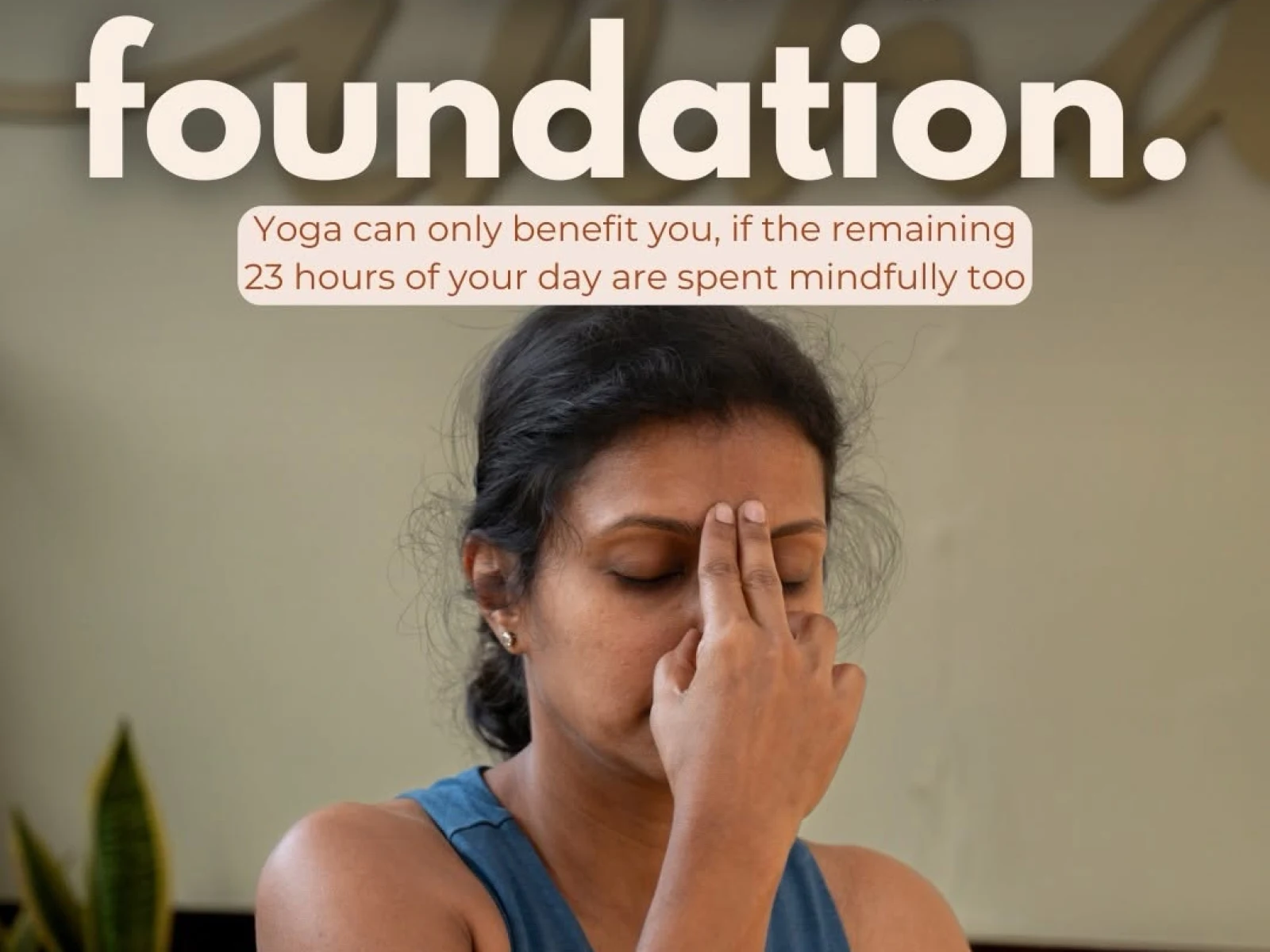 A woman practicing pranayama with her eyes closed, seated indoors in a calm yoga setting. Text reads, “Fix the foundation. Yoga can only benefit you, if the remaining 23 hours of your day are spent mindfully too.” Absolute Yoga logo appears at the bottom.